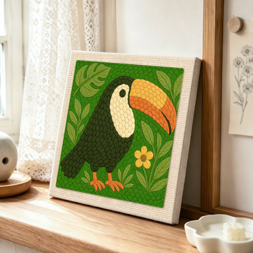 Cute tropical toucan punch needle artwork displayed on a table