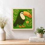 Finished cute tropical toucan artwork displayed on a wall