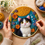 Creating the cute tuxedo cat and bright flowers wool painting by hand with a felting needle