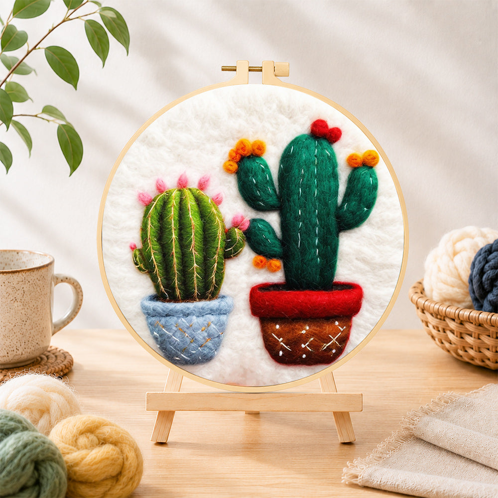 Finished cute twin potted cacti needle felting displayed on a wooden easel