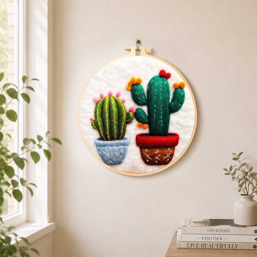 Cute twin potted cacti needle felt wall art displayed in a bright home interior