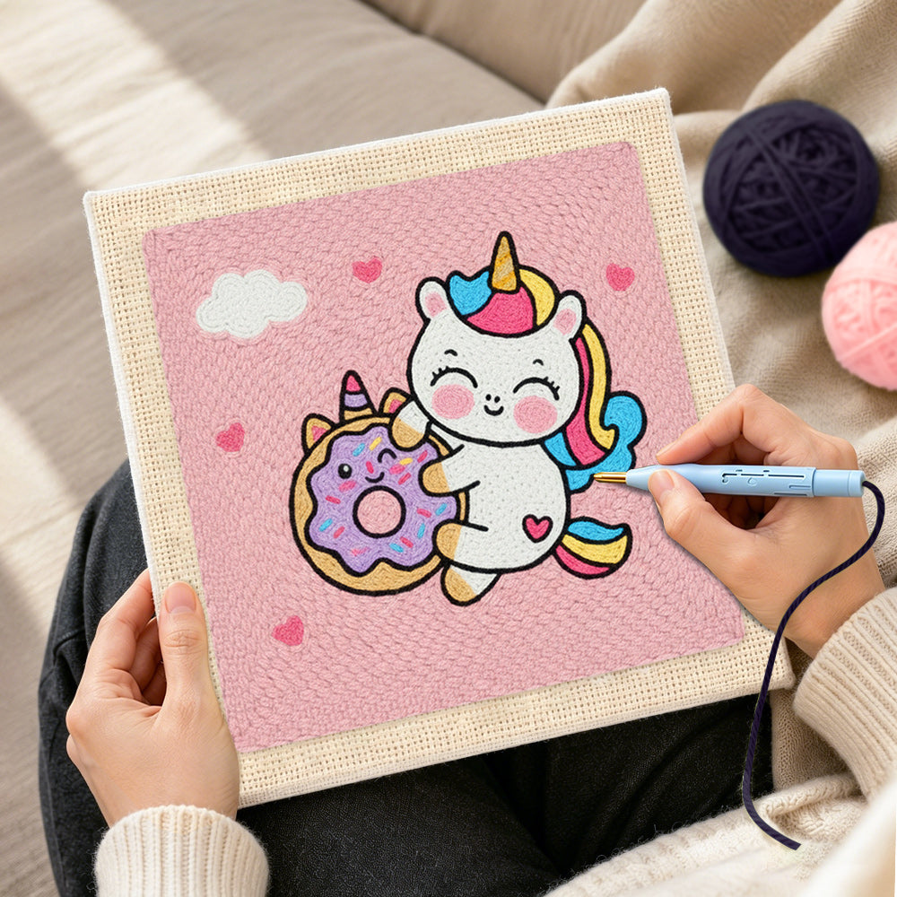 Creating handmade cute unicorn hugging a donut punch needle artwork