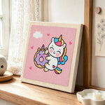 Cute unicorn hugging a donut punch needle artwork displayed on a table