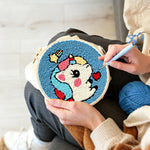 Creating handmade cute unicorn with hearts punch needle artwork
