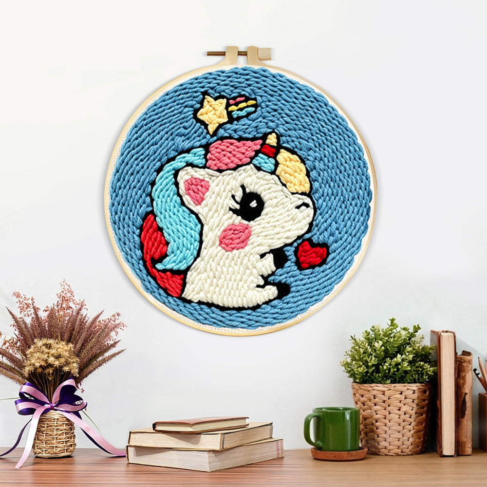 Finished cute unicorn with hearts artwork displayed on a wall