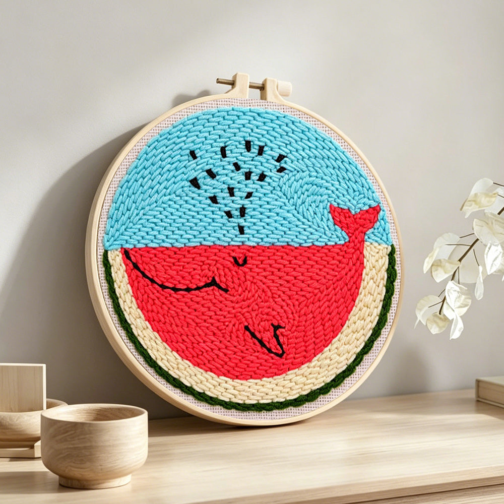 Cute watermelon slice character punch needle artwork displayed on a table