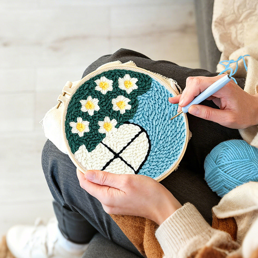 Creating handmade cute window view with white flowers punch needle artwork