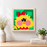 Finished cute yellow chick artwork displayed on a wall