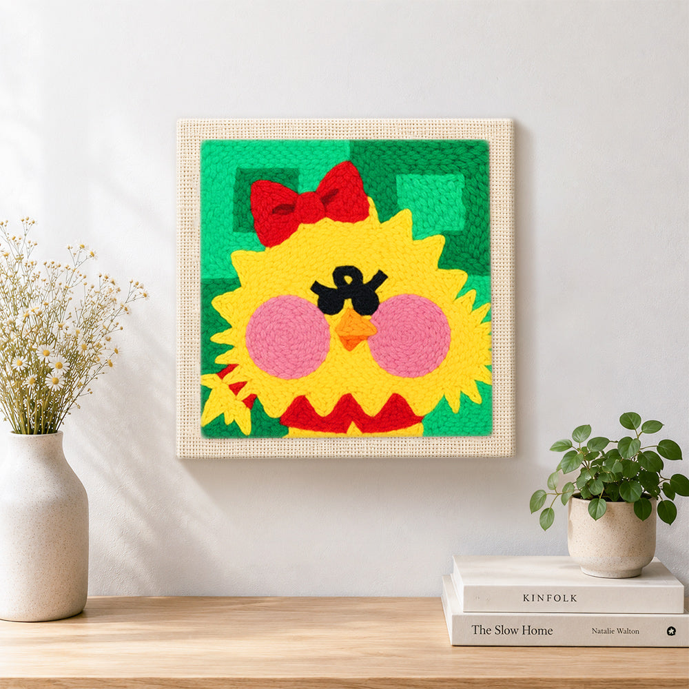 Finished cute yellow chick artwork displayed on a wall