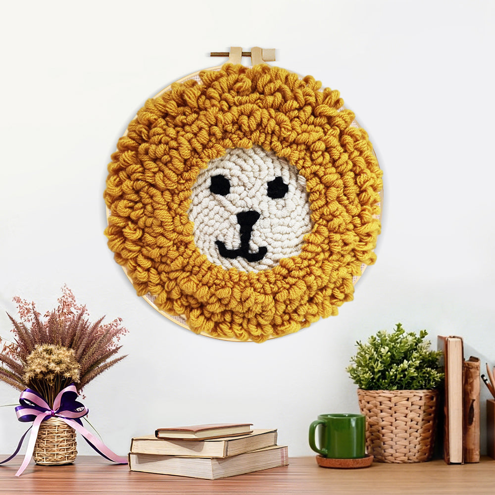 Finished cute yellow lion face artwork displayed on a wall