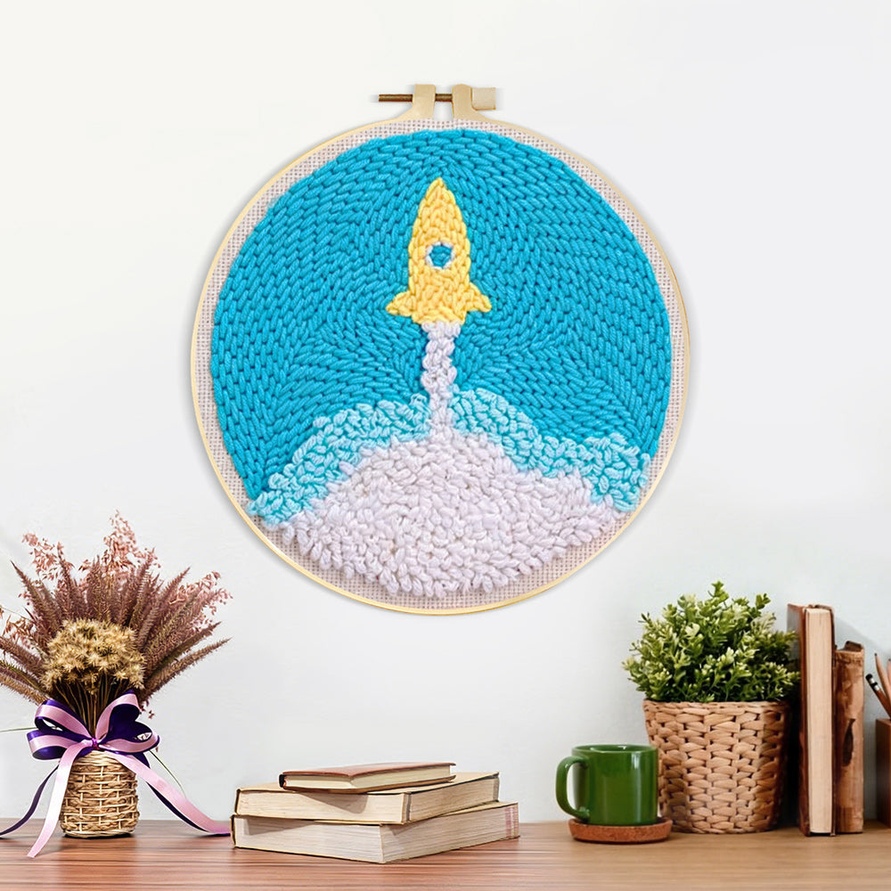 Finished cute yellow rocket launch artwork displayed on a wall