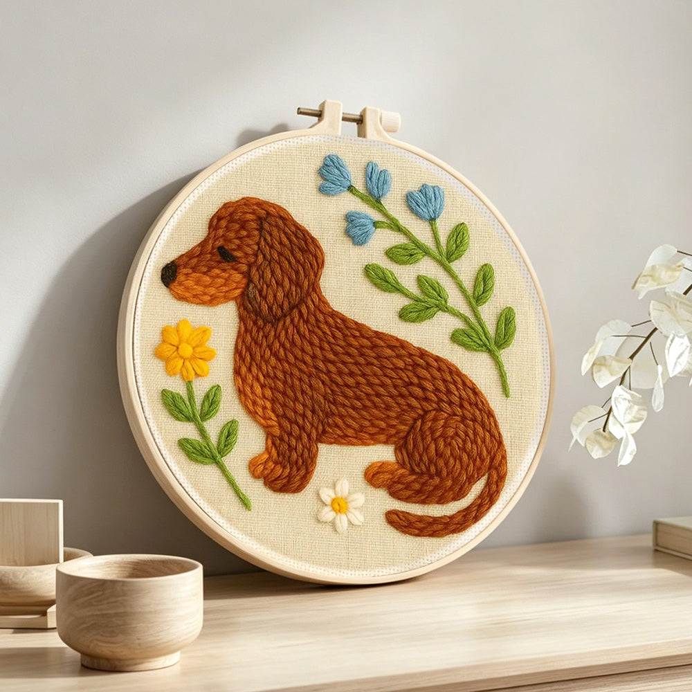 Dachshund with flowers punch needle artwork displayed on a table