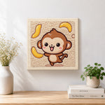 Finished dancing monkey with flying bananas artwork displayed on a wall