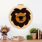 Finished dark brown lion face artwork displayed on a wall