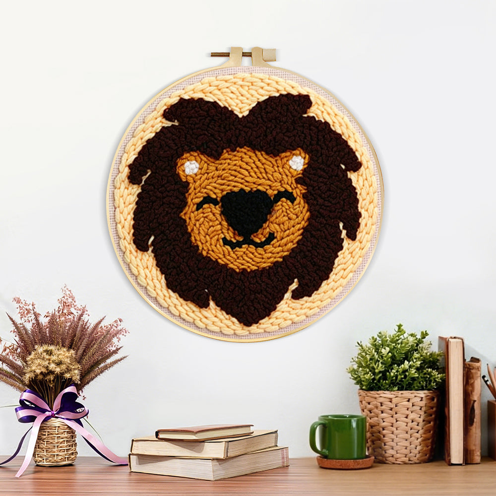 Finished dark brown lion face artwork displayed on a wall