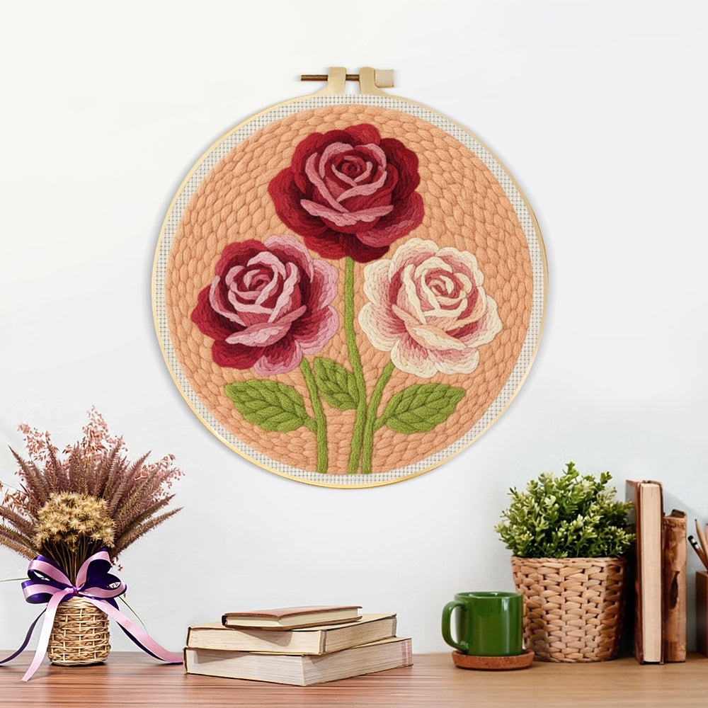 Finished deep pink and cream roses artwork displayed on a wall