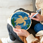 Creating handmade deep-sea turtle punch needle artwork