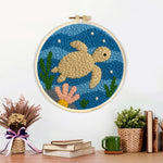 Finished deep-sea turtle artwork displayed on a wall