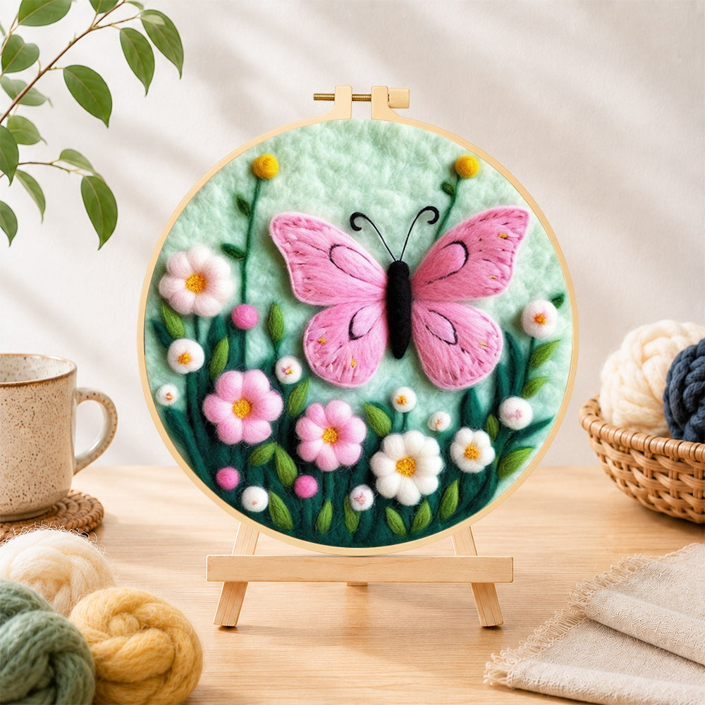 Finished delicate pink butterfly and flowers needle felting displayed on a wooden easel