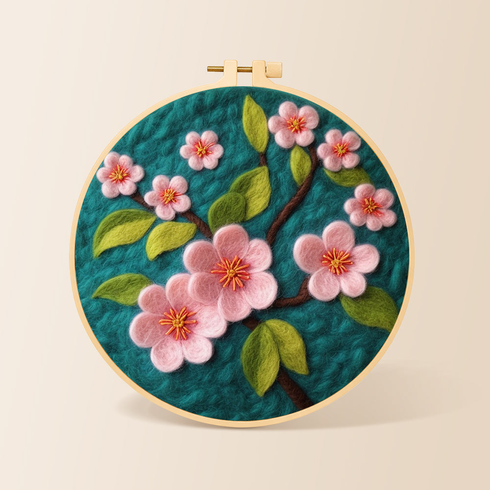 Delicate pink flowers on dark green needle felting kit for beginners with a round wooden frame