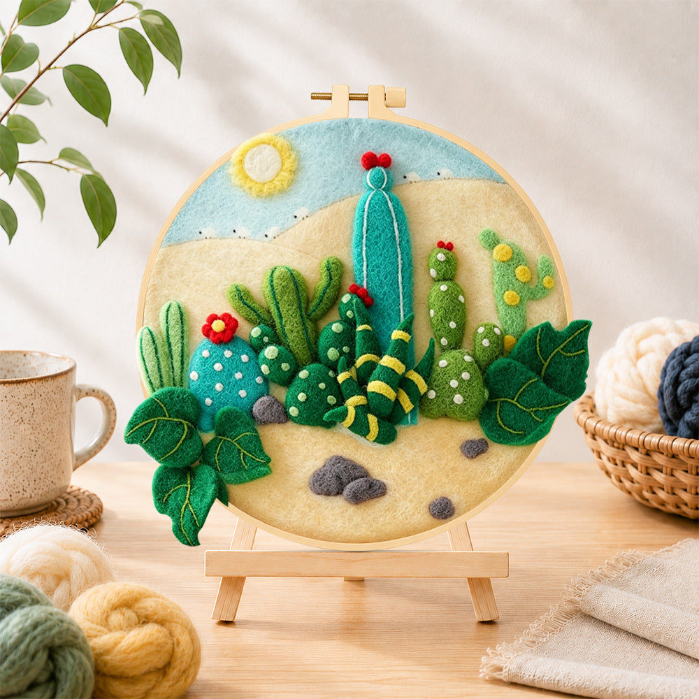 Finished desert cacti under the sun needle felting displayed on a wooden easel