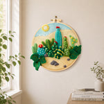 Desert cacti under the sun needle felt wall art displayed in a bright home interior