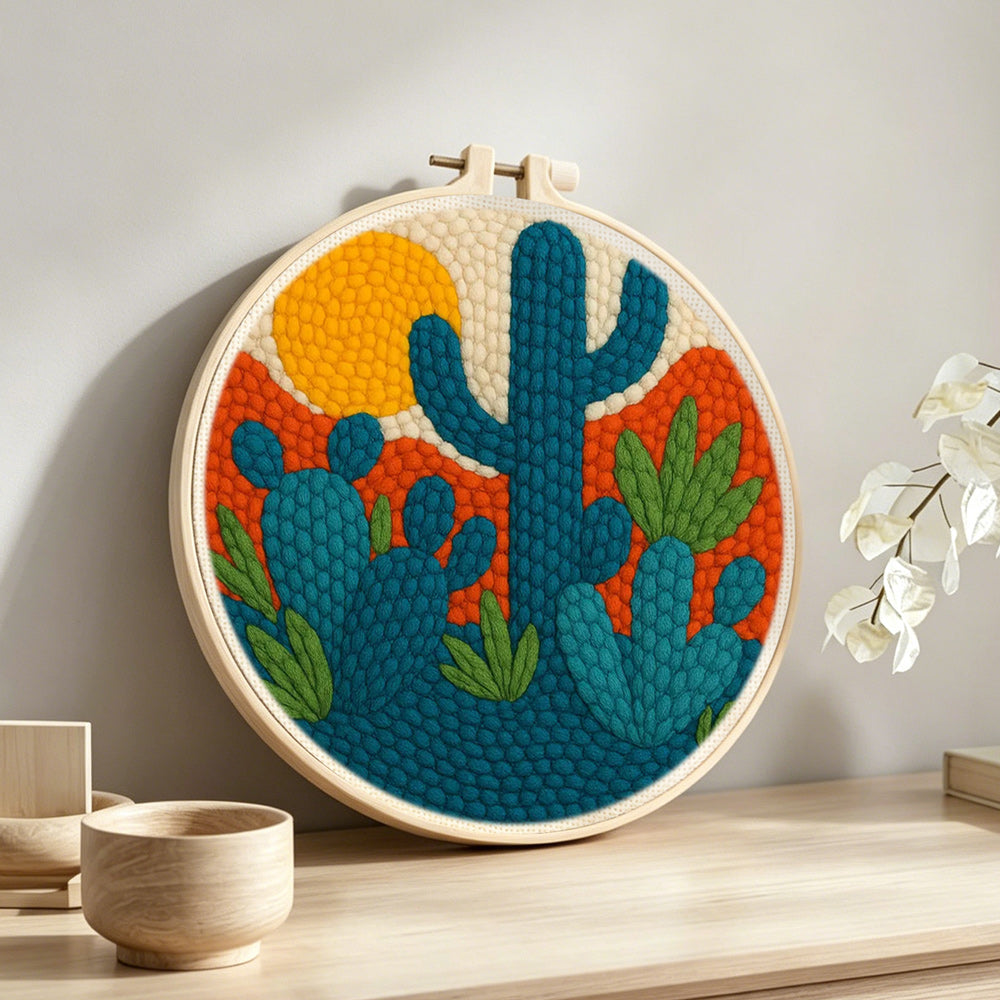 Desert cactus punch needle artwork displayed on a table