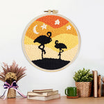 Finished desert flamingos at night artwork displayed on a wall