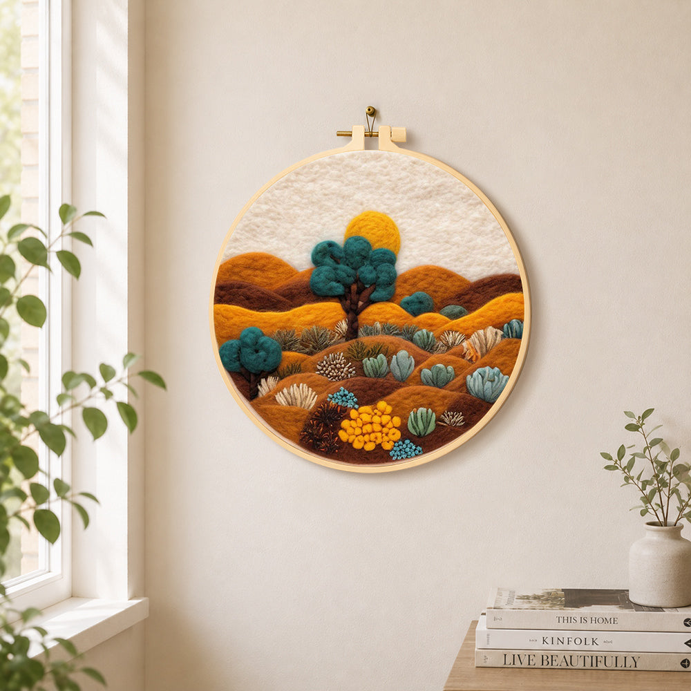 Desert landscape with succulents needle felt wall art displayed in a bright home interior