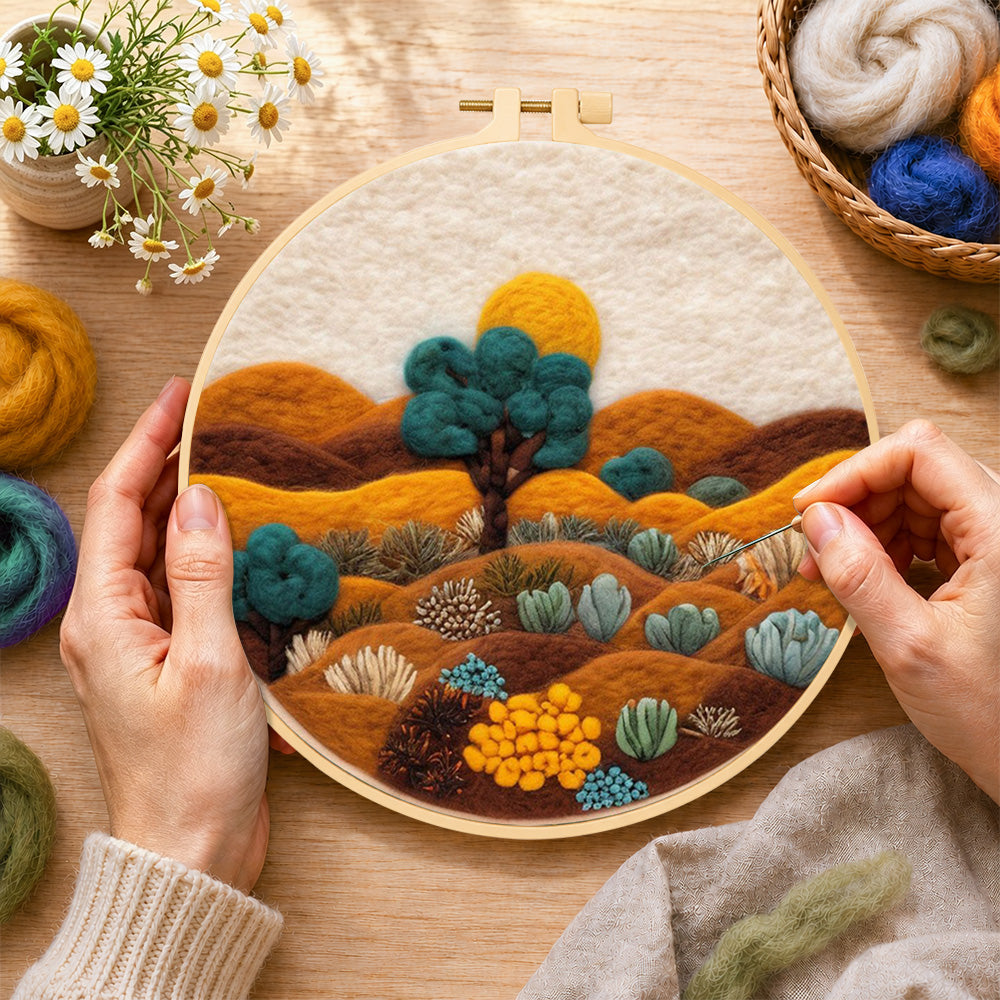 Creating the desert landscape with succulents wool painting by hand with a felting needle