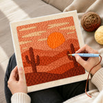 Creating handmade desert sunset and cacti punch needle artwork