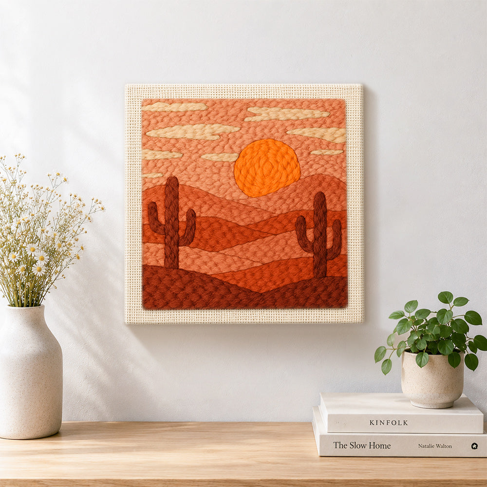Finished desert sunset and cacti artwork displayed on a wall