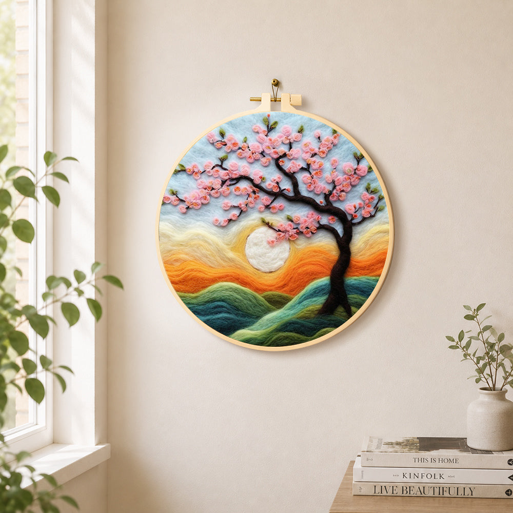 Dreamy cherry tree at sunset needle felt wall art displayed in a bright home interior