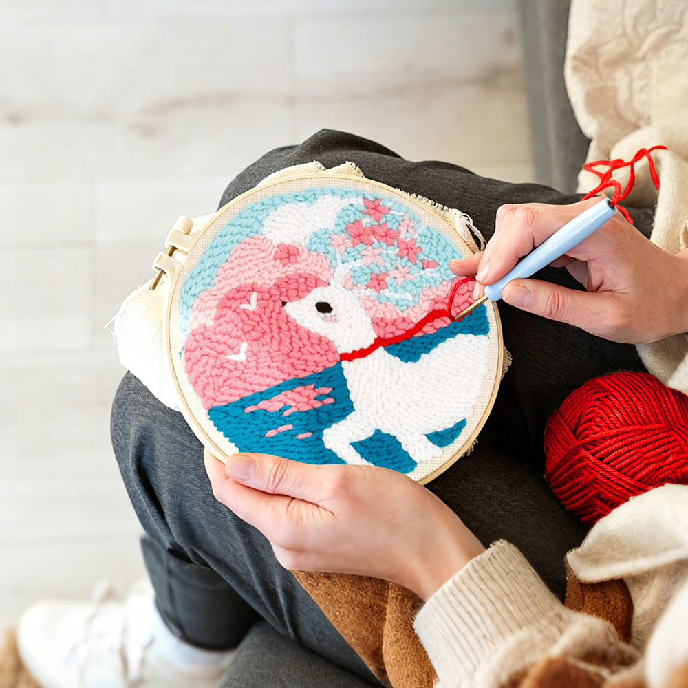 Creating handmade dreamy clouds, sea, and white deer punch needle artwork