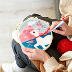 Creating handmade dreamy clouds, sea, and white deer punch needle artwork