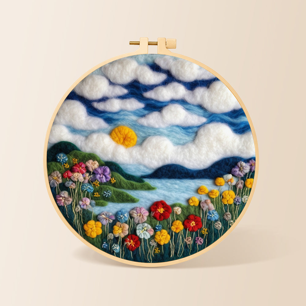 Dreamy cloudscape and flower meadow needle felting kit for beginners with a round wooden frame