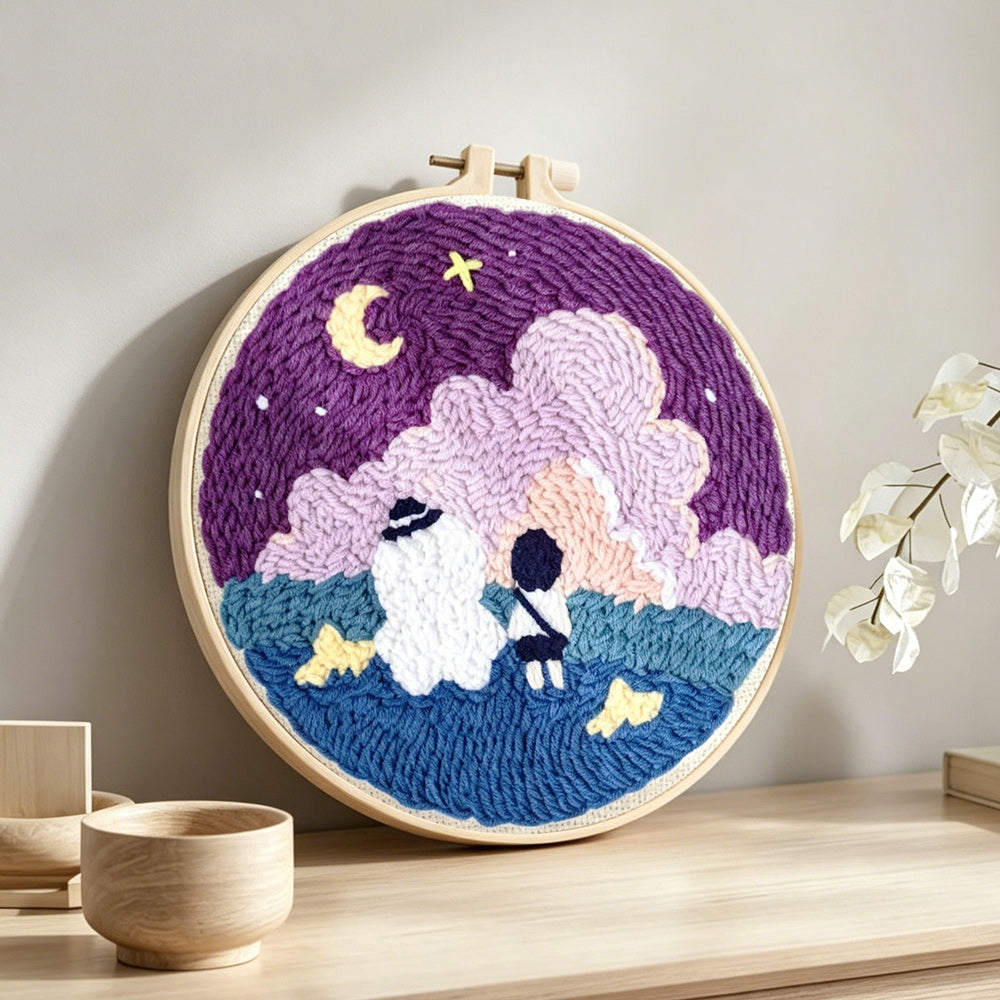 Dreamy night sky punch needle artwork displayed on a table