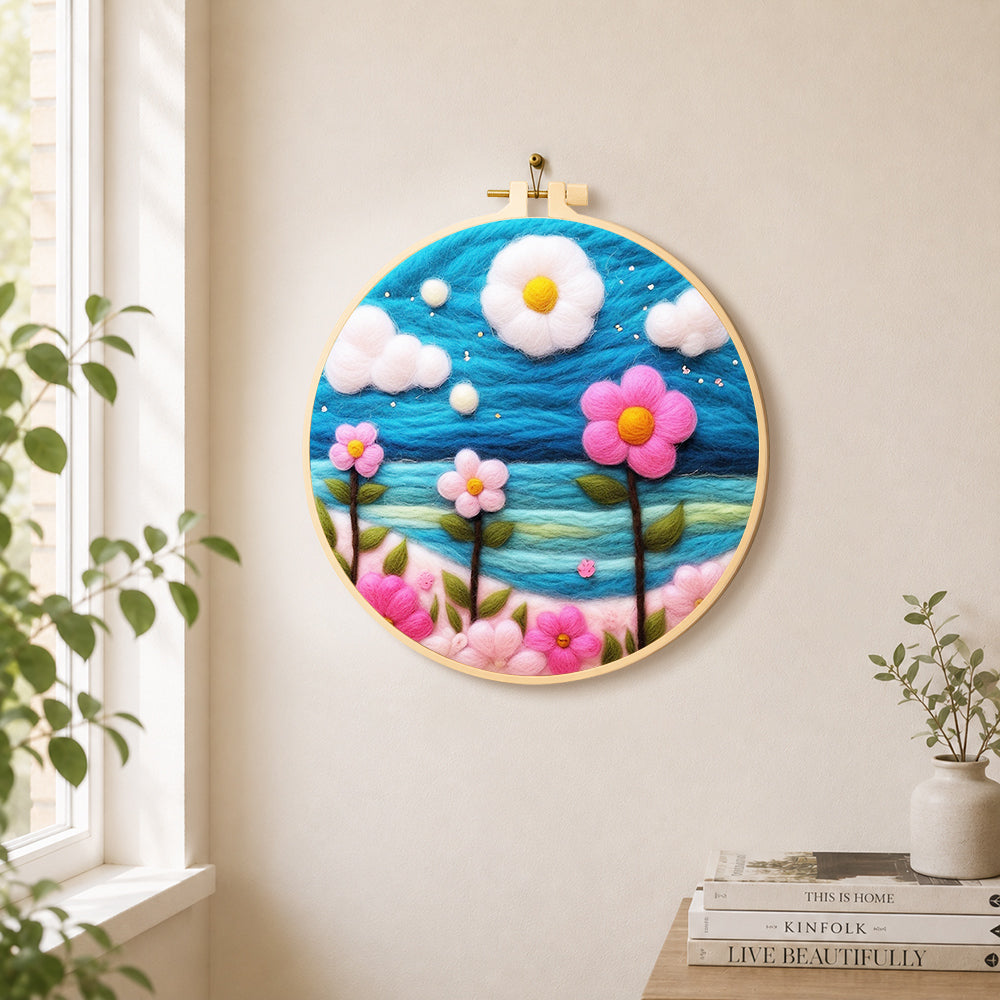 Dreamy pink flowers under the blue sky needle felt wall art displayed in a bright home interior