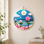 Dreamy pink flowers under the blue sky needle felt wall art displayed in a bright home interior