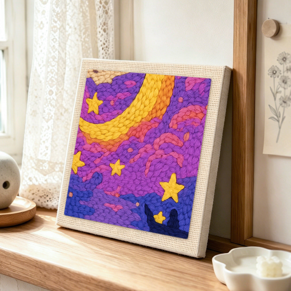 Dreamy purple starry night punch needle artwork displayed on a table