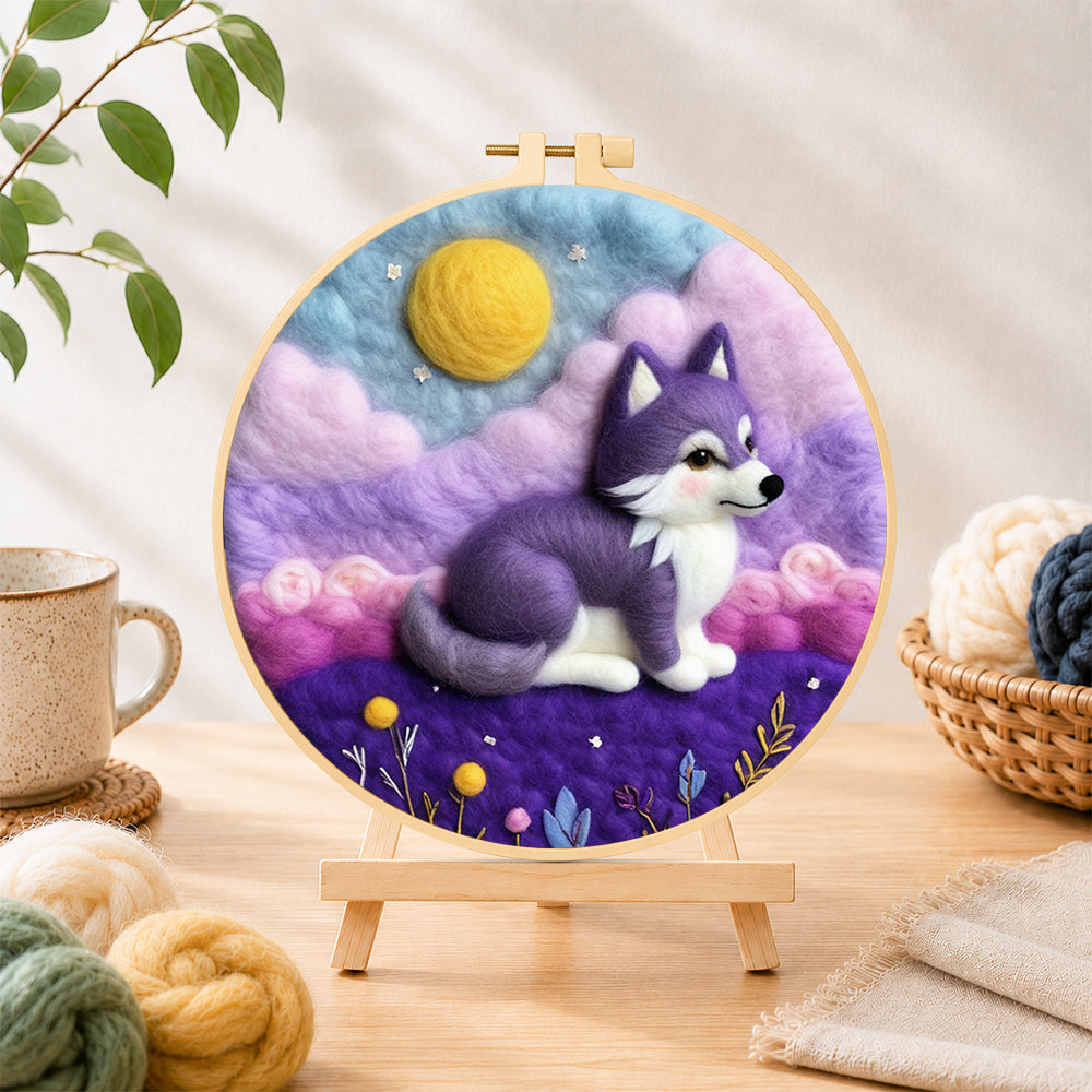 Finished dreamy purple wolf needle felting displayed on a wooden easel