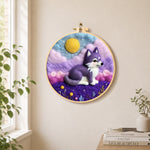 Dreamy purple wolf needle felt wall art displayed in a bright home interior