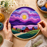 Creating the dreamy swirling purple sky and red barn wool painting by hand with a felting needle