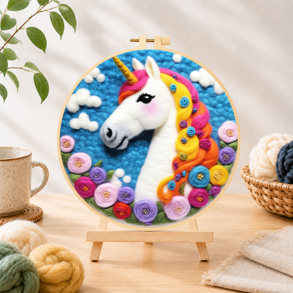 Finished dreamy unicorn and flowers needle felting displayed on a wooden easel
