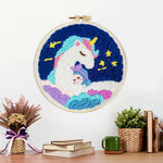 Finished dreamy unicorn on clouds artwork displayed on a wall