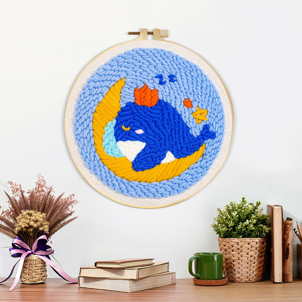Finished dreamy whale and moon artwork displayed on a wall