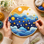 Creating the drifting blue clouds and yellow stars wool painting by hand with a felting needle