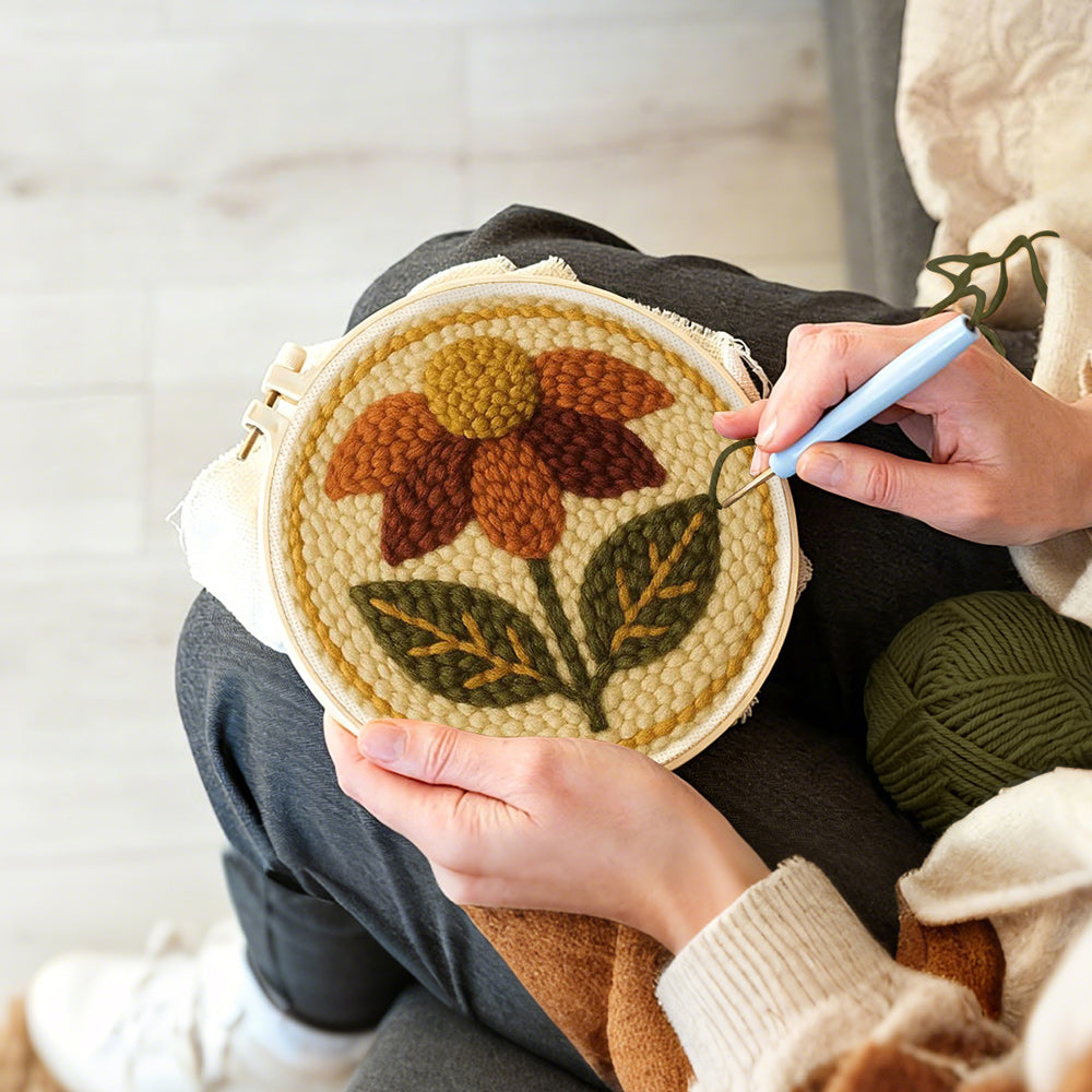 Creating handmade earth tone autumn flower punch needle artwork