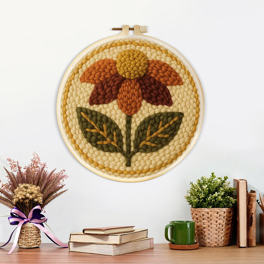 Finished earth tone autumn flower artwork displayed on a wall