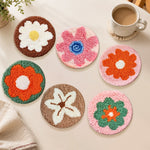 Earth-toned flowers punch needle coasters used for home decoration